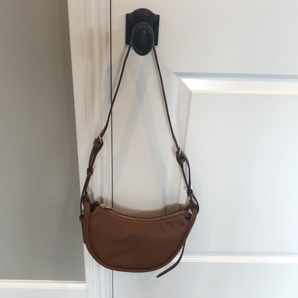 A new day target crescent bag